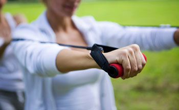 Woman using a resistance band to exercise