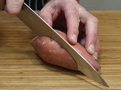 Cube the yam by slicing it first lengthwise