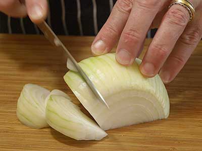 A good technique is to think of the onion as a clock and cut at each hour - 1 o’clock, 2 o’clock, etc.