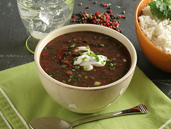 black bean soup garnished with sour cream - click for recipe!
