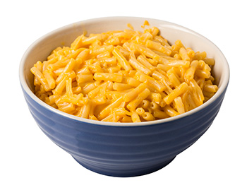 a bowl of mac and cheese made from a boxed mix - a highly processed food