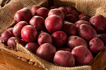 a basket of red potatoes