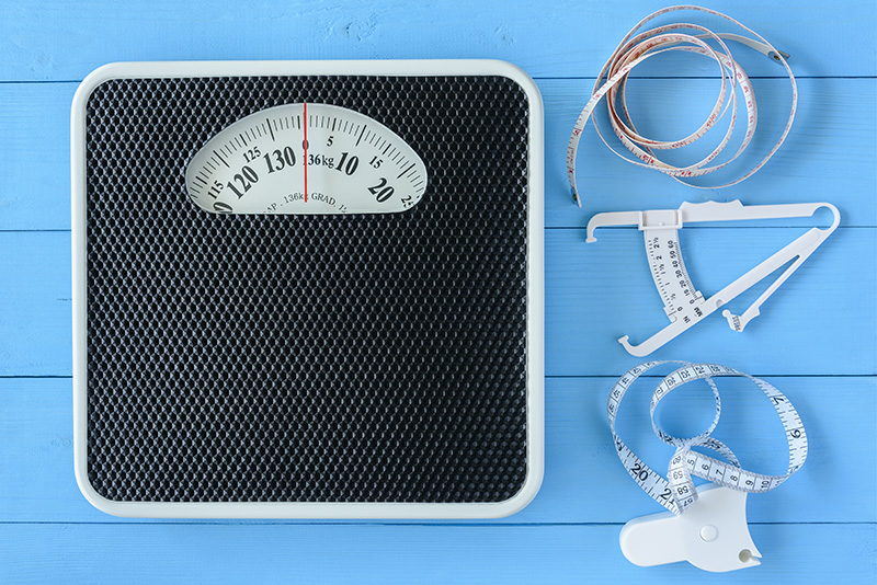 items used to measure weight, waist circumference, or body fat: a scale, measuring tapes, and calipers