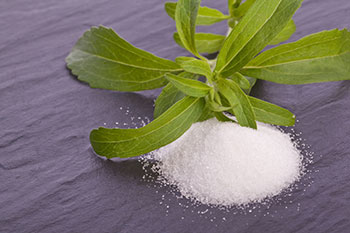stevia powder and the leaves of the stevia plant