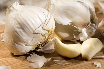 Cloves of garlic on a cutting board