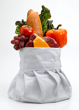 a traditional white chef's hat filled with healthy ingredients