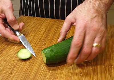Slice the ends off the cucumber
