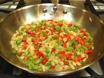 Cook the peppers and onions for about 2 minutes. Stir frequently.