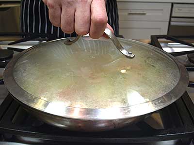Cover and cook, stirring every 2 minutes and allowing the condensed water to flow into the pan.