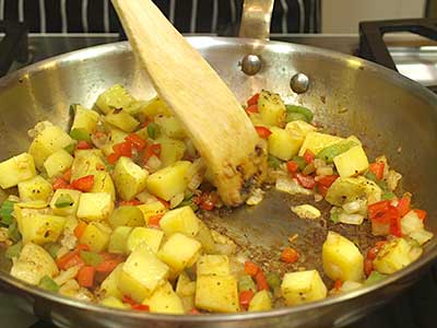 Scrape the browned (caramelized) bits from the bottom of the pan and stir into the potatoes.