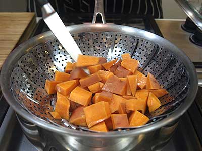 The yams are done with a knife slips easily into the flesh.