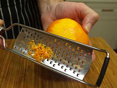 Just stroke the microplane gently along the surface of the orange.