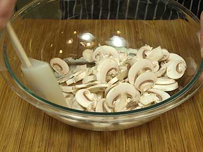 and gently fold the mushrooms into the dressing,
