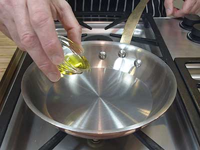 Place the olive oil in a small skillet over medium high heat.