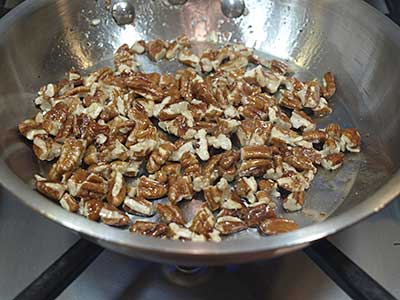 Stir frequently so that the pecans brown, and adjust the heat, if necessary, so the pecans don't burn.