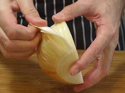 Peel the onion and discard the papery outer layer.