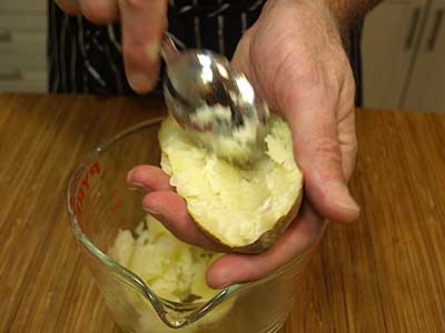Leave about 1/4 inch of the flesh so the potato forms a bowl, then set aside.