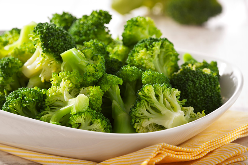 a bowl of freshly steamed broccoli