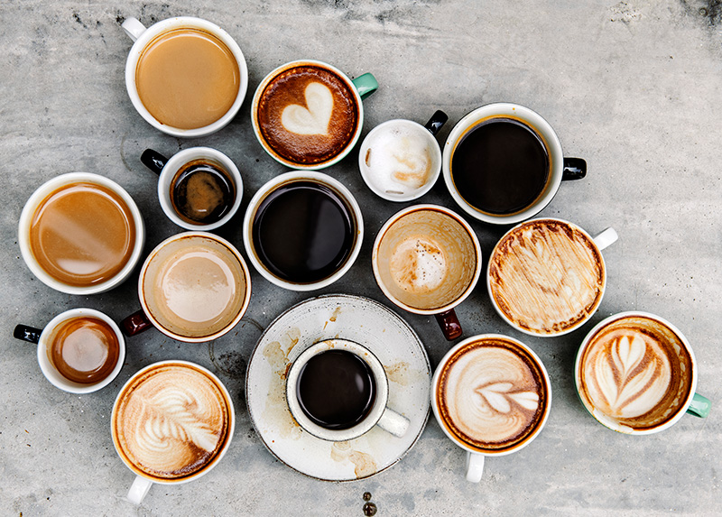 a variety of coffee drinks seen from above