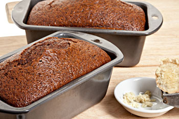 Two loaves of gingerbread still in the pans