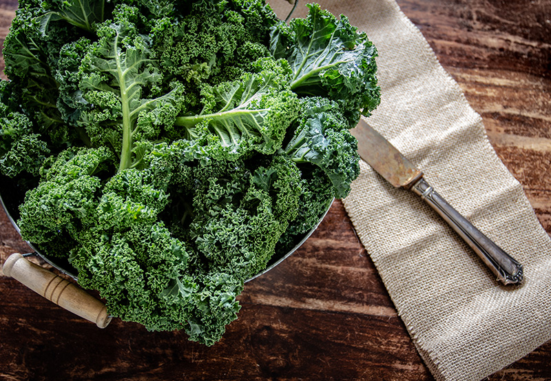 a basket of fresh kale, a food high in flavonols