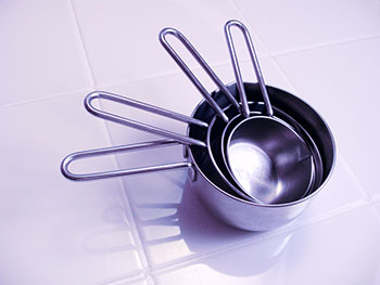 a set of metal measuring cups