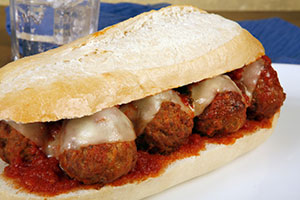 a meatball hoagie made with low-acid tomato sauce