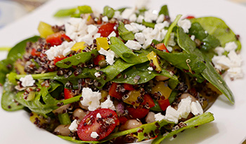 a Mediterranean Quinoa Salad, with fresh vegetables, fruits, low-fat cheese, and olive oil
