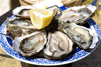 A tray of oysters on the half shell. Oysters are a good source of iron.