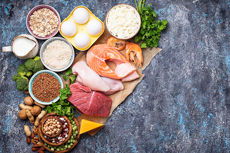 common food sources of protein, including fish, eggs, beef, legumes, and quinoa
