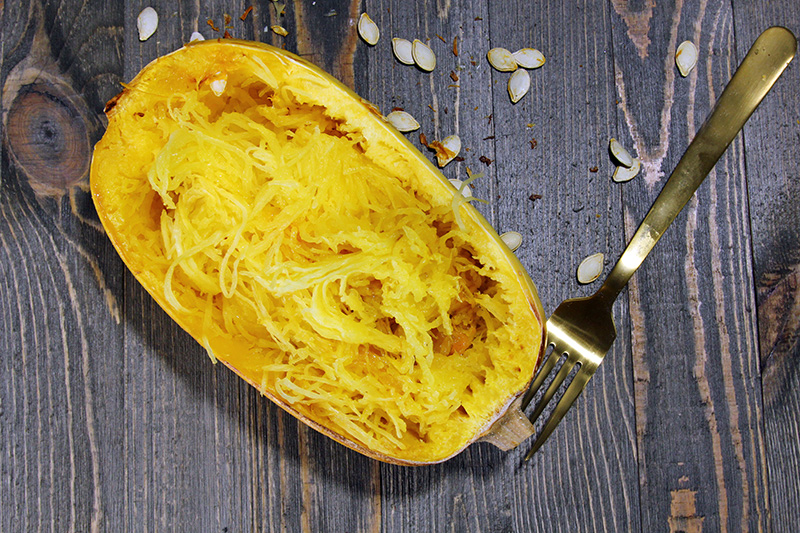 a cooked spaghetti squash halved lengthwise