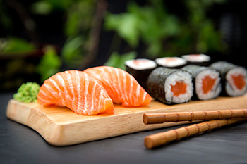 salmon nigiri and a salmon roll
