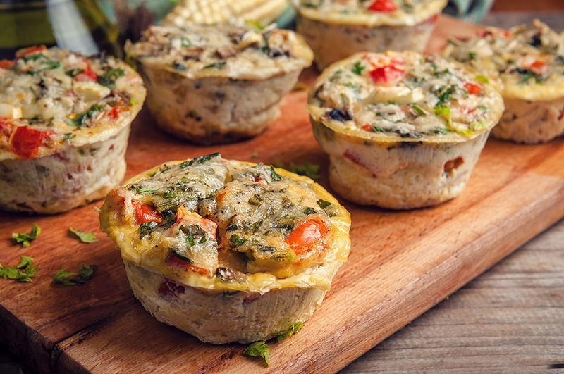 muffin-sized egg dishes with vegetables and cheese, a good healthy breakfast