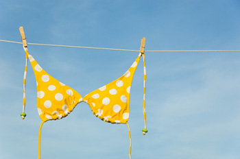 a bikini top hanging from a clothesline