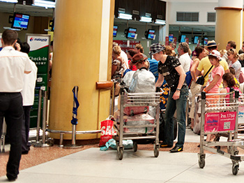 people waiting in line at an airport