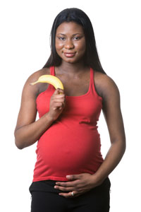 Pregnant woman with banana